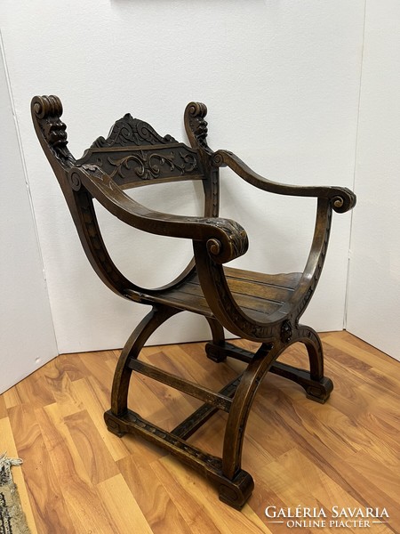 Antique carved Savonarola armchair