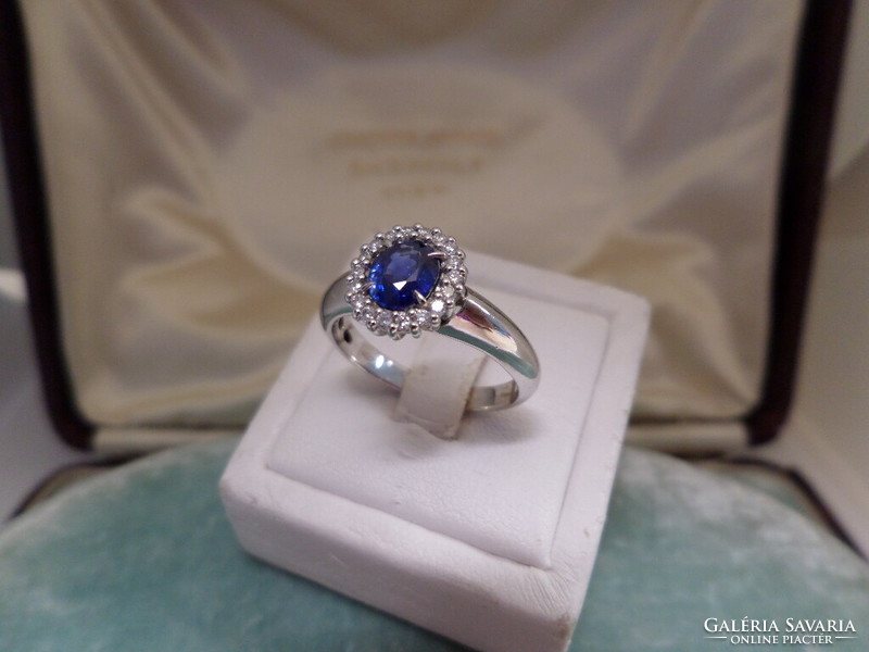 White gold ring with beautiful colored blue sapphires and brilliants