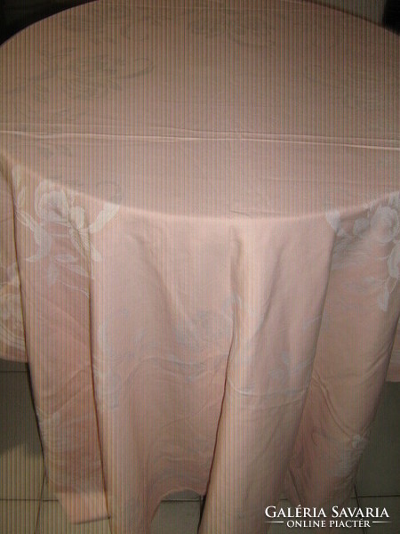 Wonderful baroque floral pattern on pink damask tablecloth