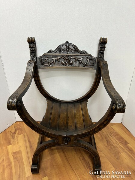 Antique carved Savonarola armchair