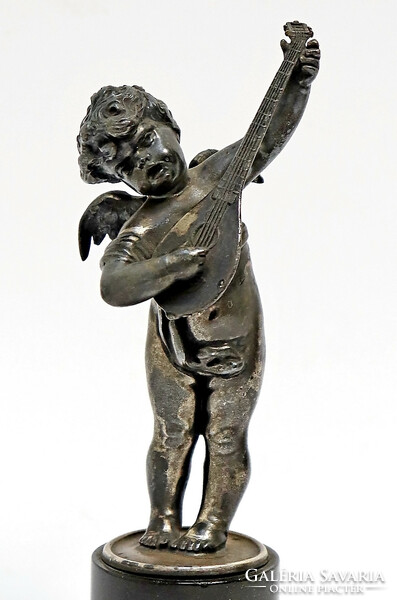 A putto playing a lute, a pewter statue