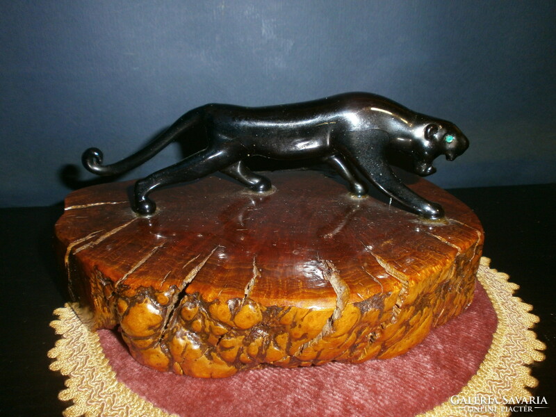 Glass jaguar on a wooden base