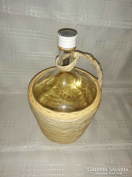 Glass bottle in wicker holder (a7)