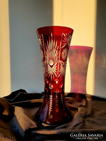 Ruby-burgundy polished crystal vase.