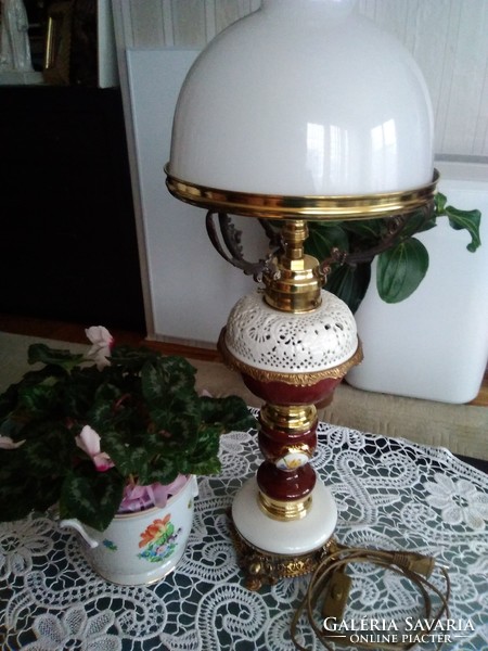 Old electric table lamp with burgundy porcelain body with white openwork pattern, copper fitting.