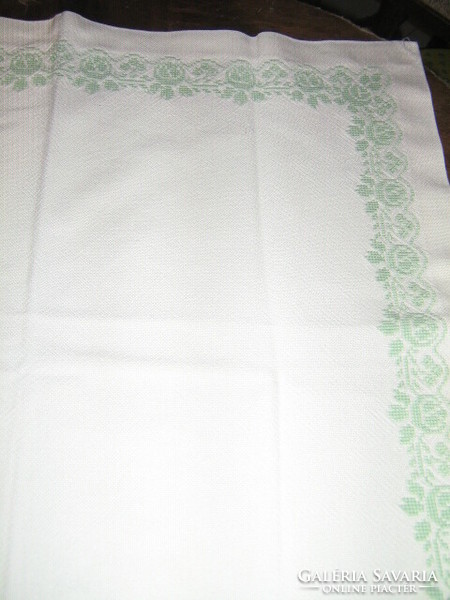 Beautiful tiny cross-stitched pale green floral white tablecloth