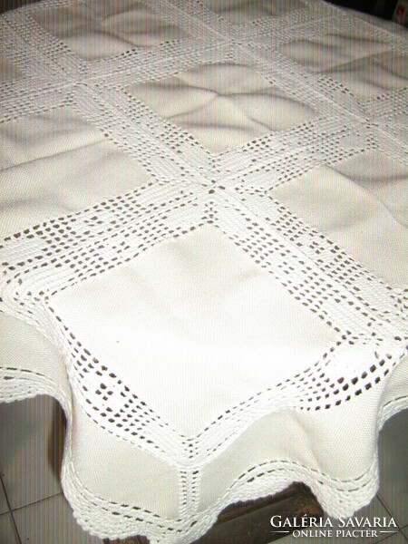 Wonderful white / ecru tablecloth with beautiful hand-crocheted floral pattern