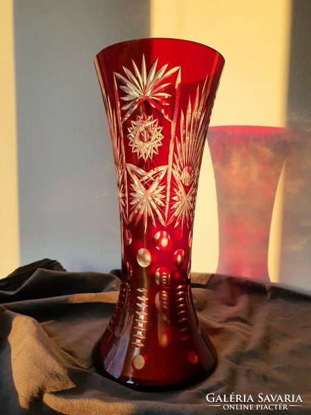 Ruby-burgundy polished crystal vase.