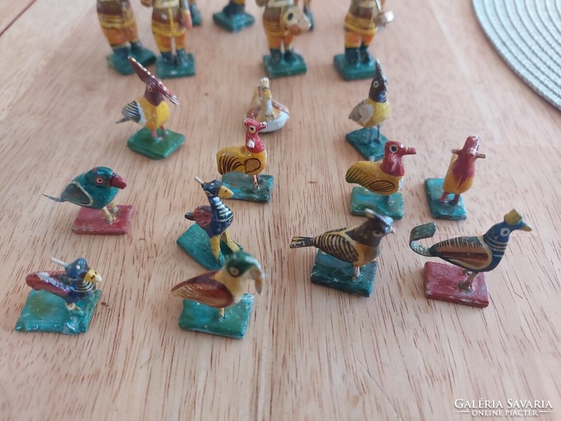 (K) small Indian wooden figures.