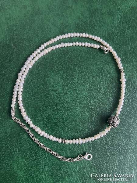 String of real pearls with silver fittings, elegant jewelry.