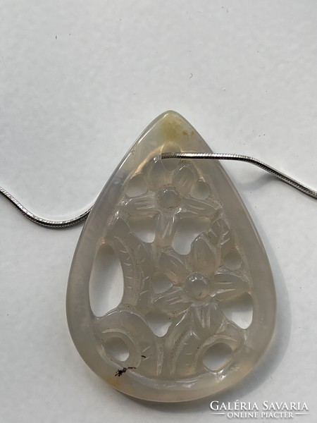 Special floral teardrop stone pendant on a silver snake chain.