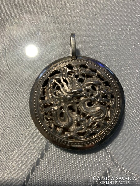 Silver pendant with a Chinese motif