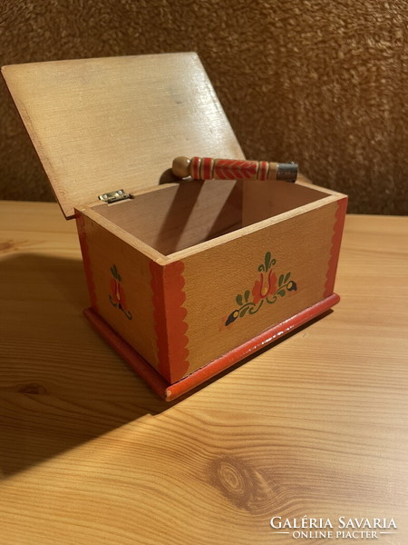 A small folk art chest with a knife