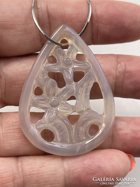 Special floral teardrop stone pendant on a silver snake chain.