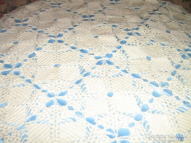 Beautiful hand crocheted tablecloth lined with blue silk