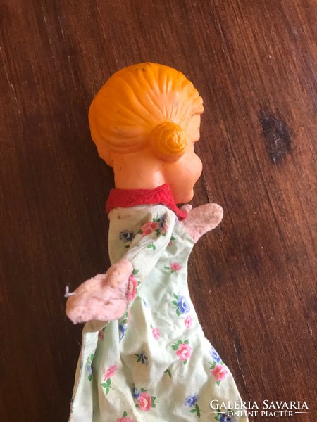 Old, antique, toy little girl doll figure. Rubber glove puppet, hand puppet. The head is completely intact, in good condition.