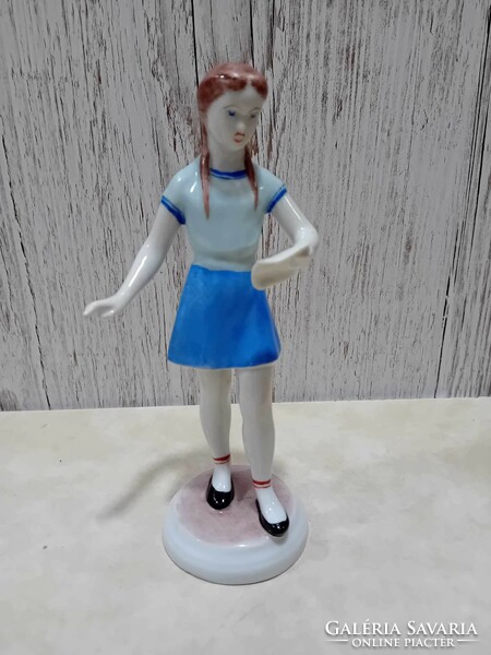 Figure of a girl singing from a porcelain sheet music from Hollóháza