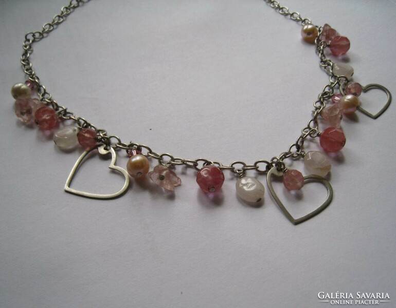 Silver necklaces with precious stones and hearts