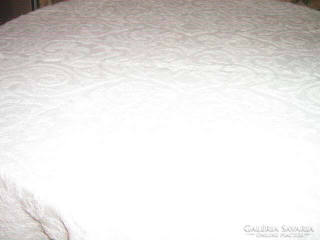 A white towel with a printed pattern in a beautiful material