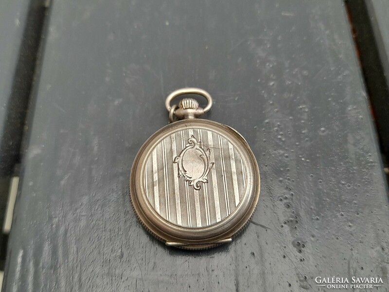 Non-functioning silver pocket watch