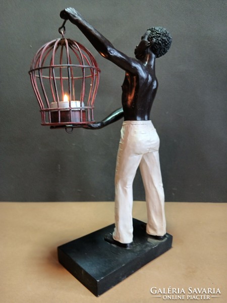 Art-deco figure statue of a black boy with a lamp. Negotiable.