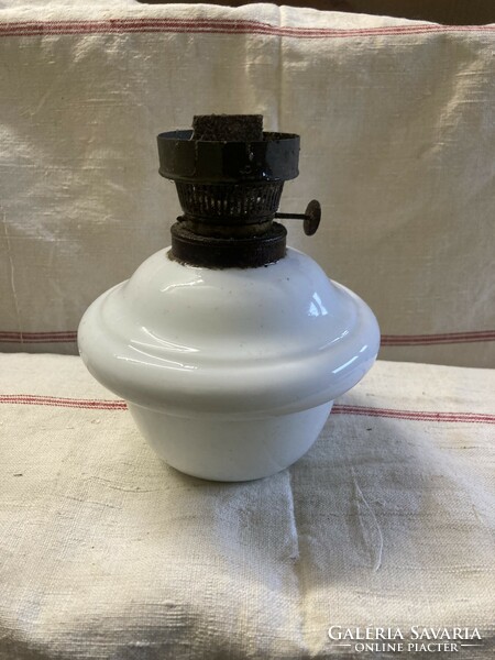 The base of the petroleum lamp is porcelain