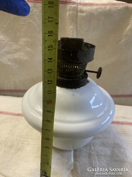 The base of the petroleum lamp is porcelain