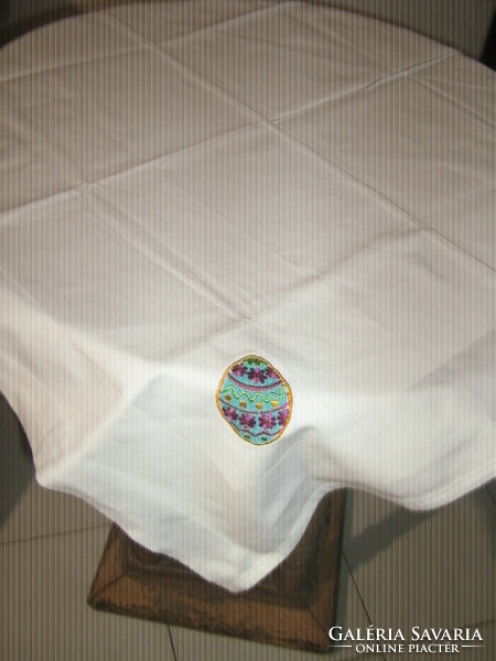 Damask tablecloth decorated with cute white Easter eggs