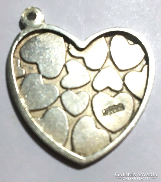 Large silver heart pendant with a special beautiful heart in relief heart motif