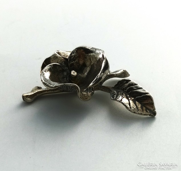 Silver figure, flower