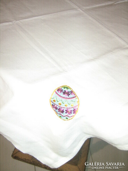 Damask tablecloth decorated with cute white Easter eggs