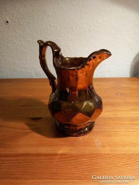 Antique luster-glazed ceramic jug, slightly worn