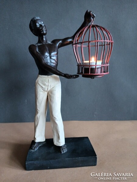 Art-deco figure statue of a black boy with a lamp. Negotiable.