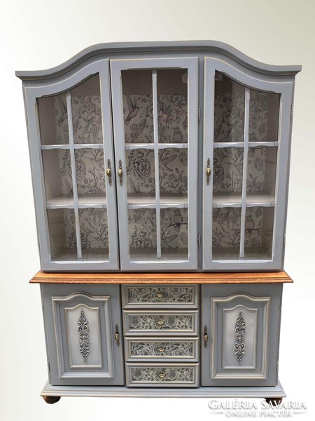 A large display cabinet with a romantic atmosphere, a sideboard