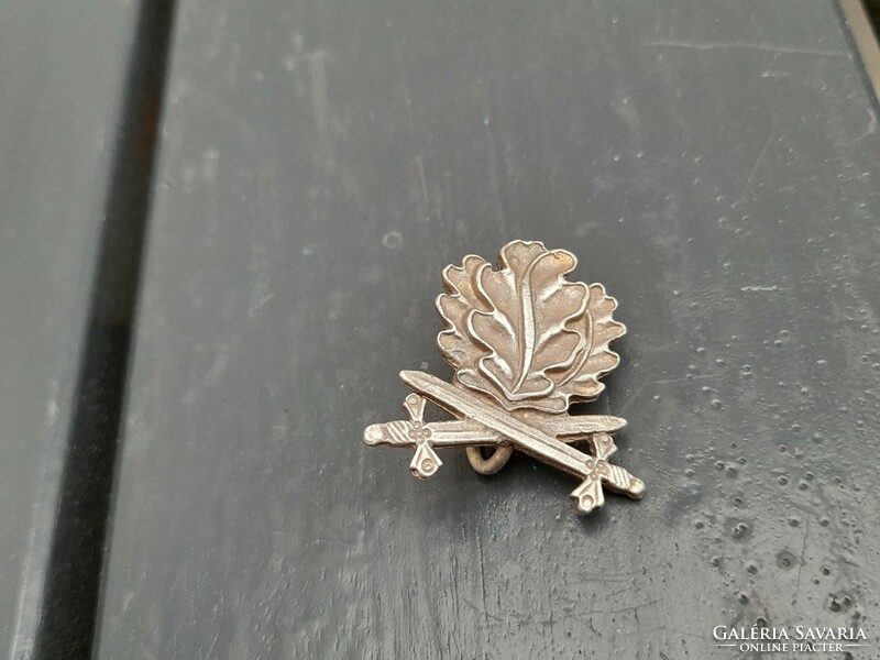 Some sort of sword military insignia or badge