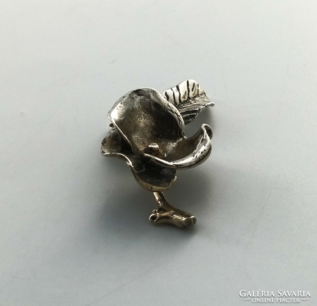 Silver figure, flower