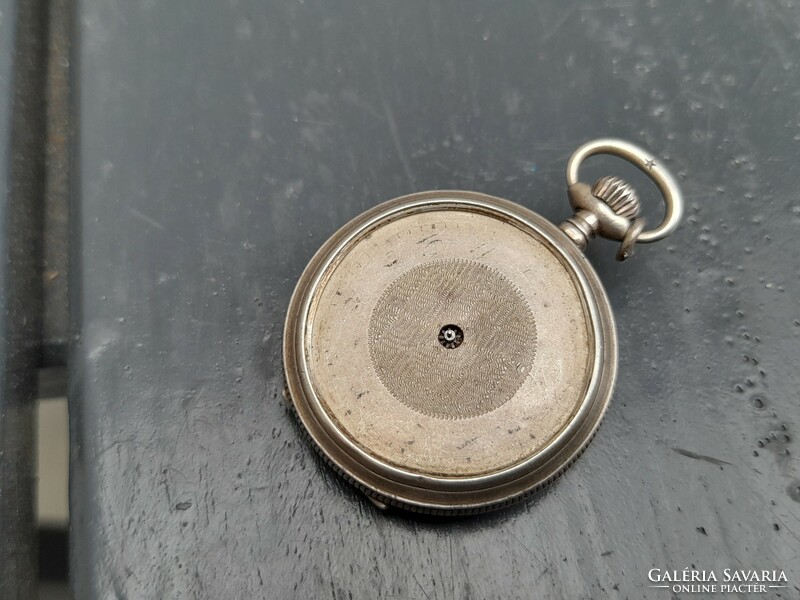 Non-functioning silver pocket watch