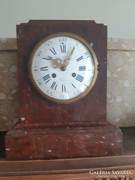 Mantel clock in a marble house