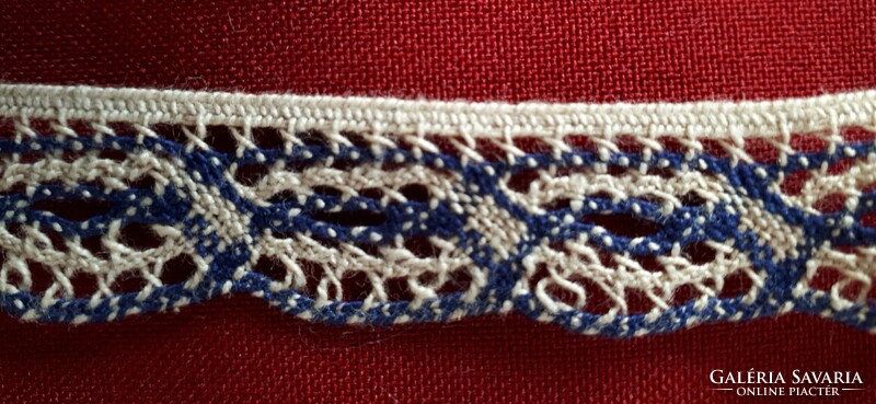Machine lace trim with ecru and navy colors