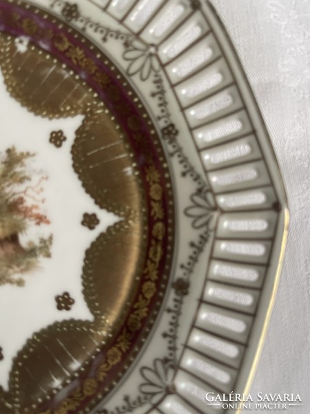 Beautiful antique scene richly gilded decorative plate with openwork edge.