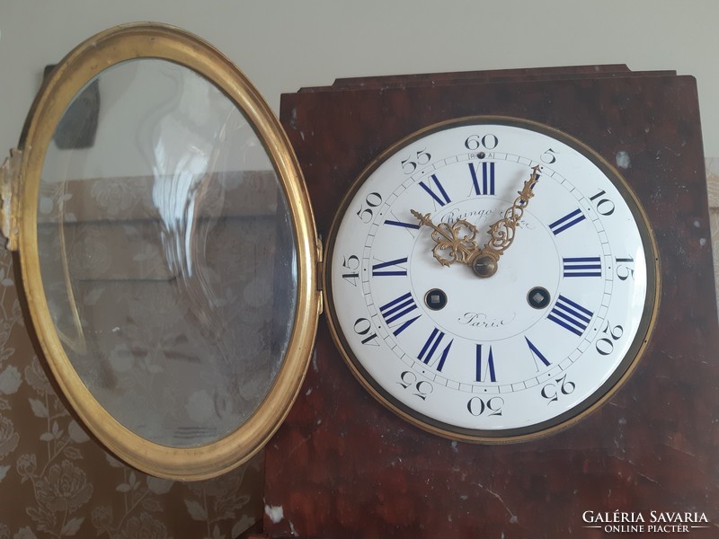 Mantel clock in a marble house