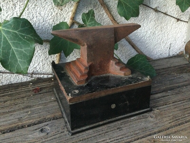 A small iron, perhaps a goldsmith's anvil