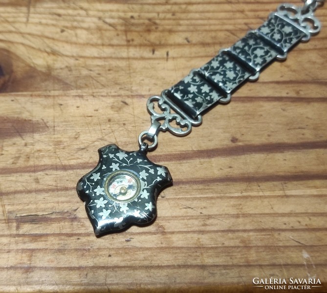 Antique niello silver compass on an officer's chain