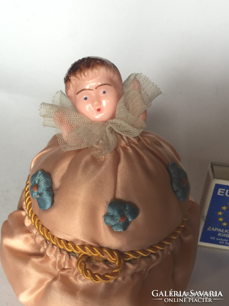 Old silk sewing, toiletry or jewelry box decorated with a smaller hard plastic doll