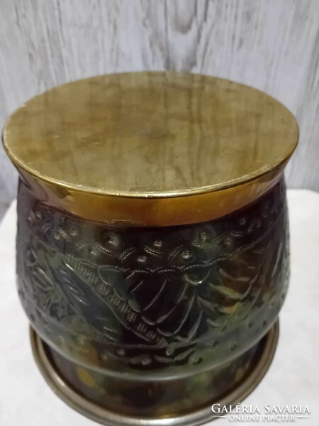 Large red copper pot with handmade decorations
