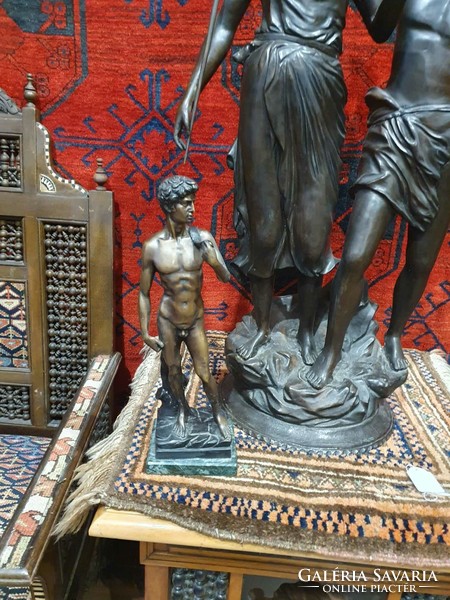 Michelangelo's statue of David in bronze. Very nicely crafted. 40cm high. On a marble plinth.