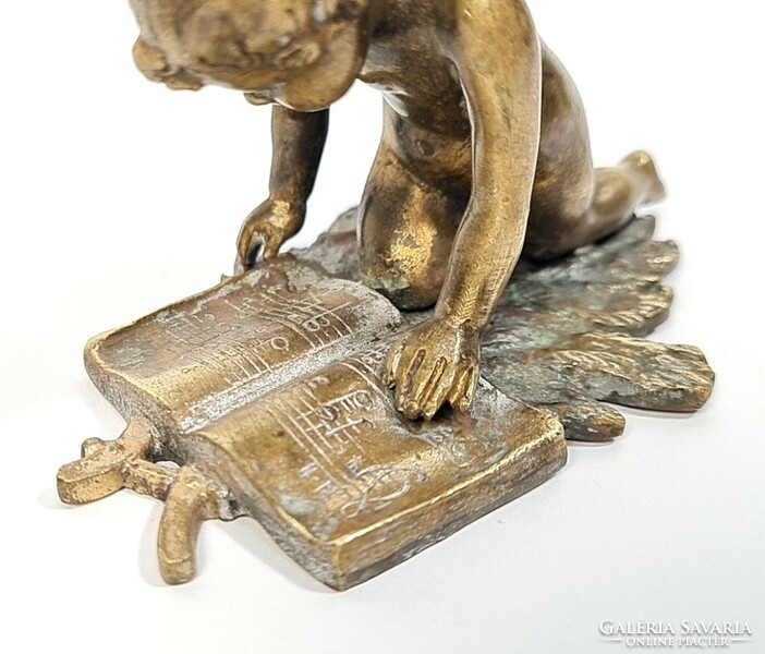 Charming antique copper/bronze statue - little girl reading sheet music on an oak leaf