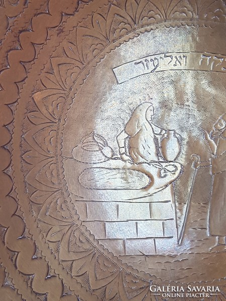 Old copper plate with wall ornament
