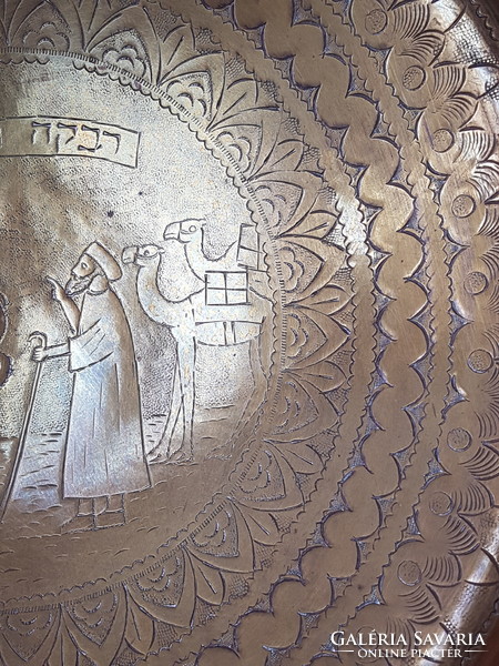Old copper plate with wall ornament