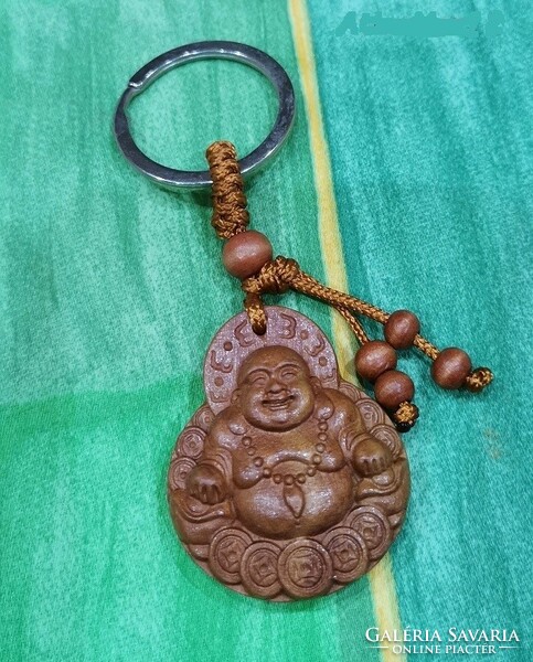Real room. Rosewood key ring, laughing Maitreya Buddha